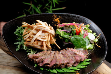 Lemongrass grilled beef steak with snow peas and taro potatoes