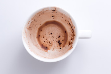Empty cocoa cup on white background