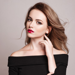 Portrait of beautiful blonde woman with curly hairstyle and bright makeup.  Natural look. studio,...