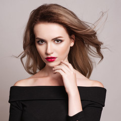 Portrait of beautiful blonde woman with curly hairstyle and bright makeup.  Natural look. studio,...