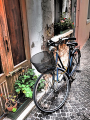 Fototapeta na wymiar Traditional italian street with a bicycles in Caorle old town. 