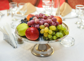 Fruit Arrangement. Fresh various fruits on table. Wedding arrangement with fresh fruits.