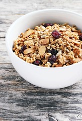 Homemade granola with nuts and dried cranberry.Selective focus