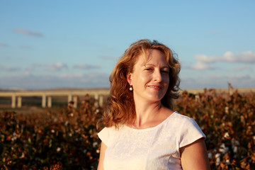 Portrait of beautiful 35 years old woman on sunset colors