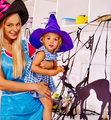 Family preparing halloween food.