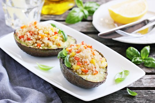 Grilled Avocado Staffed With Quinoa Vegetables  Salad.Selective Focus