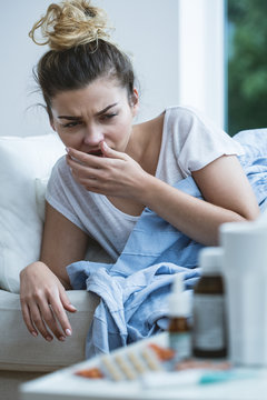 Sick woman coughing