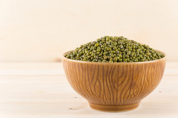 green beans on wood background