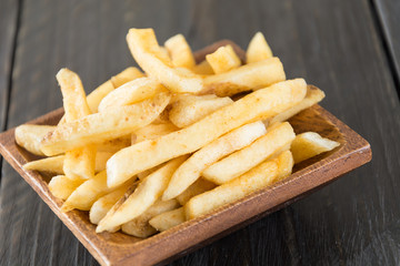 french fries on wood background