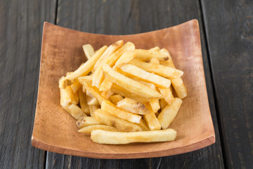 french fries on wood background