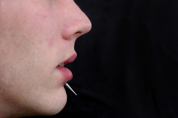 Obraz premium A close up on a mans face with a piercing