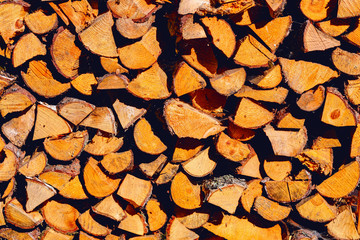 Stack of firewoods on the sun.