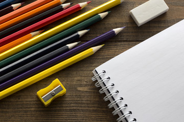 crayons, notebook , eraser and pencil sharpener