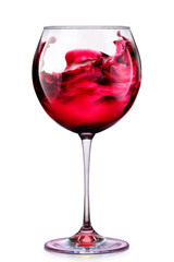 Glass of red wine with splashes isolated on a white 