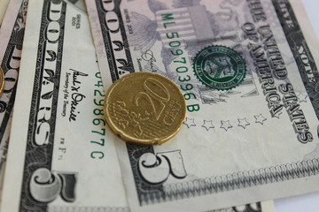 Euro coin  against the backdrop of the American dollar