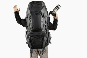 hiker with raised arms with a camera and a backpack