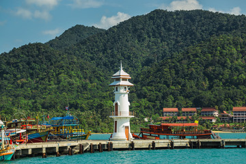 Fototapeta na wymiar Lighthouse on a Bang Bao pier on Koh Chang Island