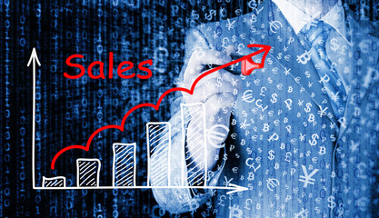 business man drawing graph of sales
