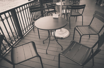 vintage tone process font of coffee shop and group of chair