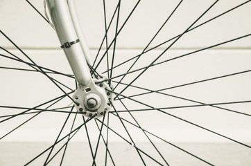 Fototapeta premium close up of bicycle wheels process in vintage retro style