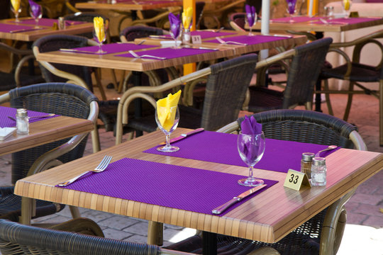 restaurant table with purple placemat