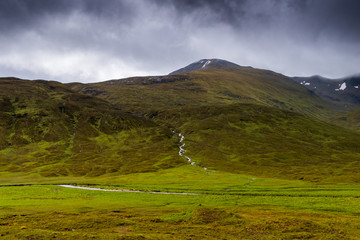 Glencoe mountains and landscape, in cloudy day, Scotland