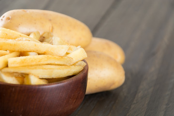 french fries on wood background
