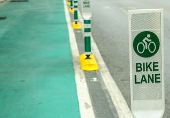 bike lane sign on cement road
