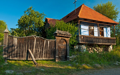 Fototapeta na wymiar Traditional old wooden carved gate in Transylvania, Romania