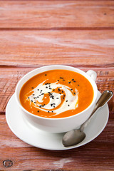 Pumpkin Soup with tomatoes, chili, yogurt and black sesame seeds