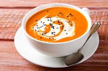 Pumpkin Soup with tomatoes, chili, yogurt and black sesame seeds