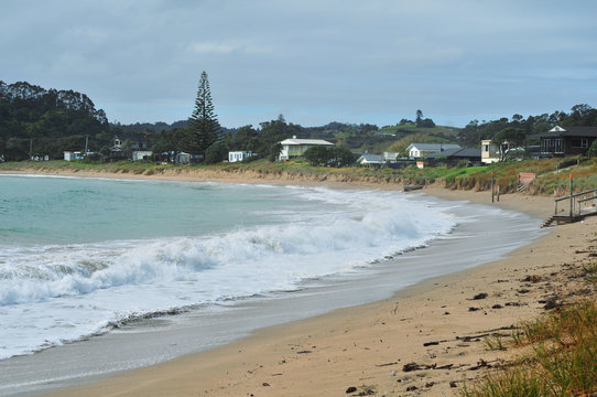 Coast of various shapes with beaches cliffs and rocky areas around Matapouri in New Zealand.