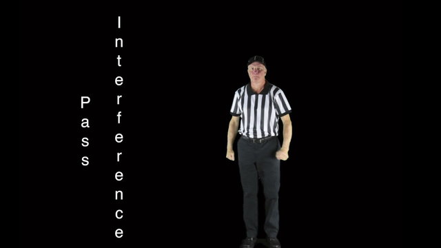 Man dressed as a football official signaling Pass Interference.