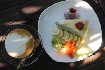 Crepe cake make from eggs, sugar, milk, cake flour
It's sweet test and very delicious when eat with Latte
Latte is a coffee 
Latte art is the art on coffee they make any graphics on a coffee