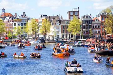 Zelfklevend Fotobehang AMSTERDAM - APR 27: People celebrating Kings Day in Amsterdam on © Nataraj