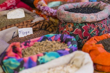 Beautiful vivid oriental market with bags full of various spices
