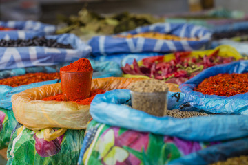 Beautiful vivid oriental market with bags full of various spices