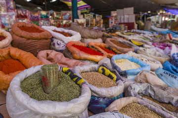 Beautiful vivid oriental market with bags full of various spices