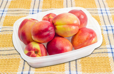 Tray with ripe nectarines