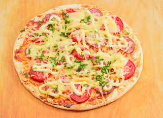 Pizza on a wooden surface