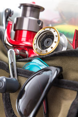 fishing tackles and lures in open handbag