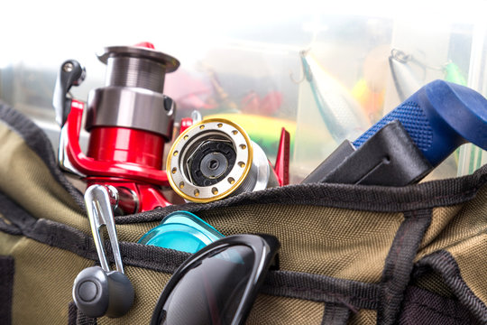 fishing tackles and lures in open handbag