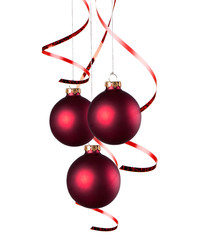 Christmas balls with curly ribbons isolated on the white background