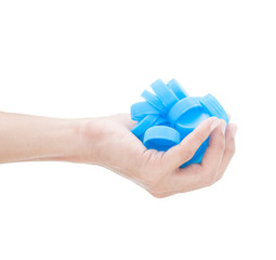 Hand holding many bottle cap of water on white background