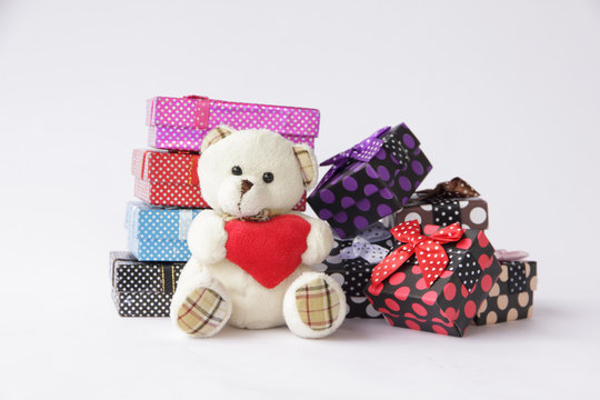 Stock Photo:.Bear toy with gift box for christmas on white backg