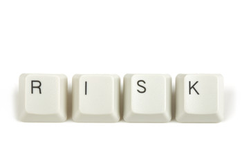 risk from scattered keyboard keys on white