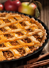 Apple pie with cinnamon sticks  close up