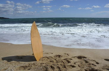 Surf board in the sand
