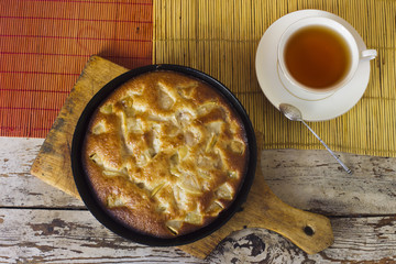Charlotte. Apple pie with tea