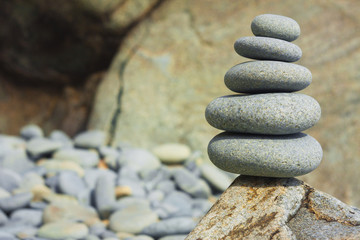 Five sea stones Balanced on the Rock. Zen stones on rock background